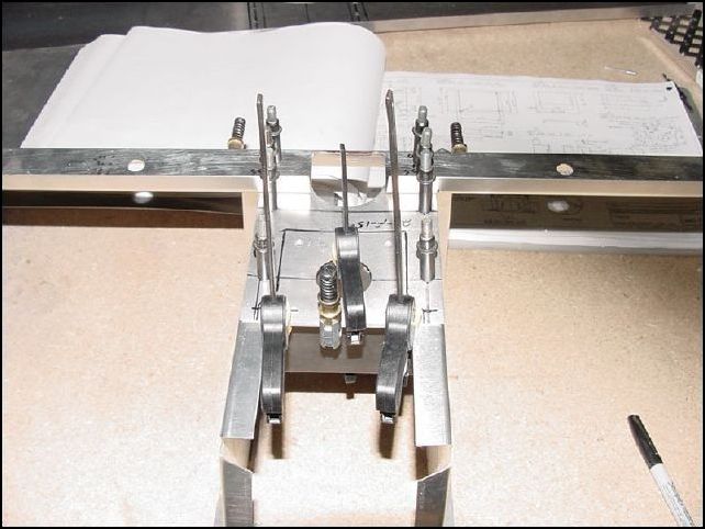 Make sure the diaphrams are in position and finish drilling the holes into the front panel.  Total of six holes per side.