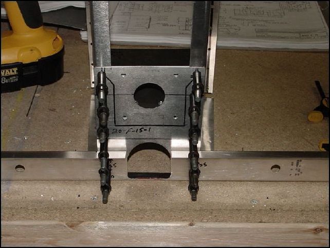 This image shows the front panel with all six holes drilled and clecoed for each side.