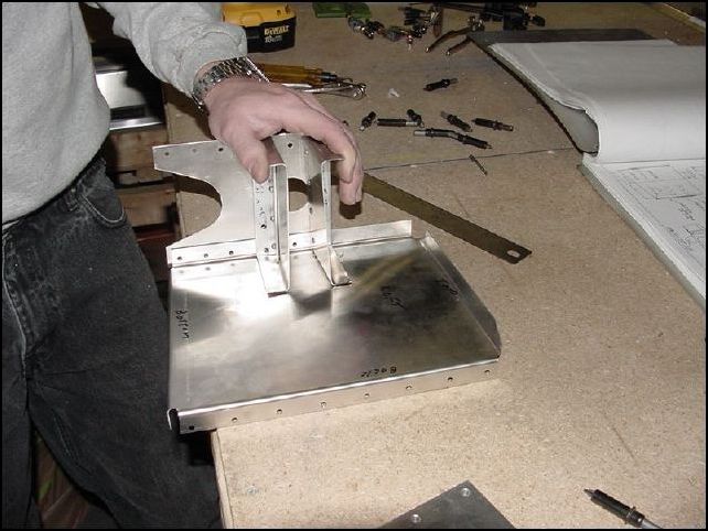 The IPL never tells you to do this step, but the drawings show the diaphrams riveted to the side walls.  Line up the diaphrams square to the front and mark their position on the side walls.