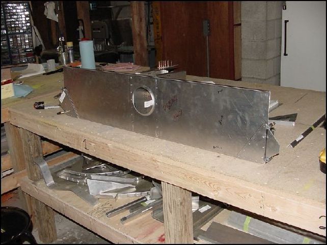 We found that the tips of the front wing attach brackets needed to be 46 mm from the edge of the side walls to make the tips 1210mm apart.