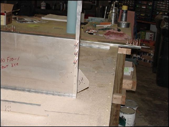 Drill and cleco through 640-F-10-2 into the front upright.