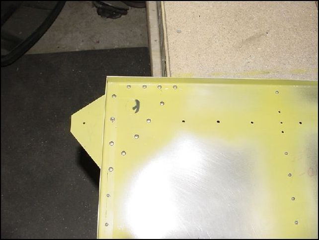 The wing attach brackets are riveted with solid rivets.  You will need to cut the rivets to the correct size.  Also be sure to drill the fuel line hole through your left wing attachment once it is riveted in place.