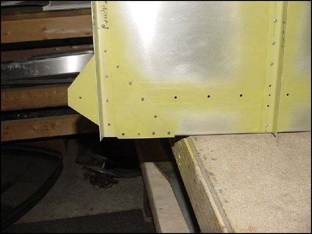 You may also notice that I messed up and placed rivets in the area that the floor support goes.  I had to drill these two rivets out, put the floor support in place and re-rivet them.  I also then found out that the AD4 rivets supplied by Zenith were not long enough to be used for the last rivet since that rivets goes through the floor support, front L, wing attach, and rear L.  So, I used an AD5 rivet in this location.  Bigger is always better I guess.  You could purchase longer AD4 rivets, but I did not want to wait and the AD5 will work just fine.