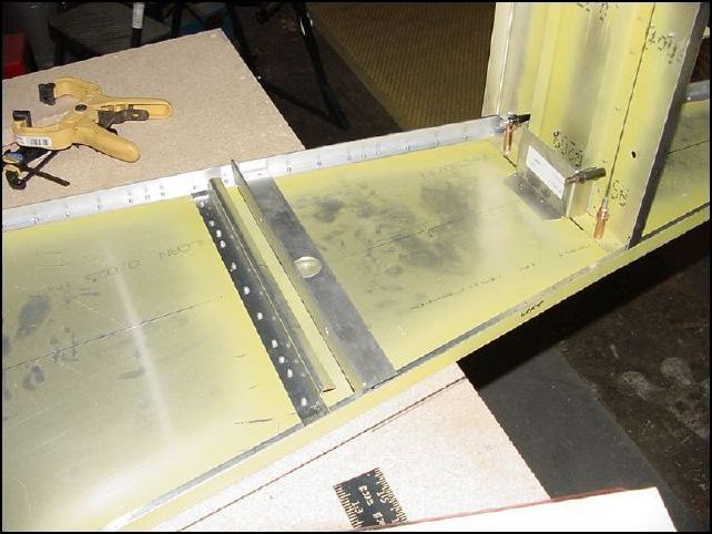 Measure 16 mm from the rear of the last floor Z and draw a line.  Position the front of 640-F-28-4 (battery support) on this line.  This image also shows F-28-1 (battery backer plate) in place against the HT frame.  I have not installed this yet and just had it in place to double check measurements against the drawing.  Which by the way did not work out so I need to call Zenair to figure out why but I don't think this is really a big deal.