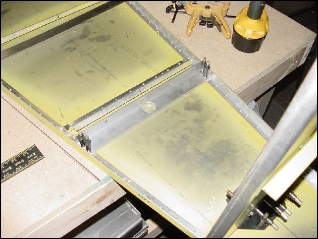 Drill two A5 rivet holes for each side of the battery support.  They should be 9mm in from the edge.  Cleco in place.