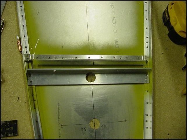 Rivet battery support in place.  NOTE:  rivet from the bottom and be sure you have it clamped in place.  The rivets are almost not long enough to hole this part in place.