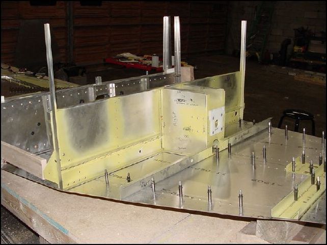 Locate the front spar to the front of the jig.  Line up the center line of the spar to the center line of the front bottom skin.