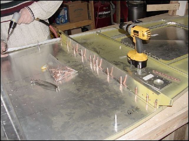 Finish drilling rivet holes in rear spar.