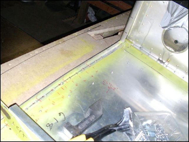 image of rivets for doubler and longerons behind the center spar.  NOTE:  DO NOT INSTALL THESE SOLID RIVETS YET.  I had to drill these back out when I installed the main gear brackets.  OOPS.