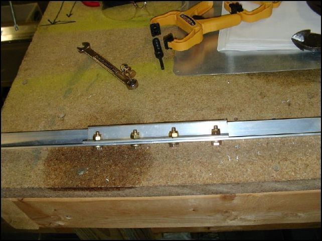 Splice the front and rear upper longerons together, this is done the same way as the splice for the lower longerons.  MAKE SURE that you do not have the bolts on the surface that your skin will rivet to.  The bolts MUST be in the top of the longeron.