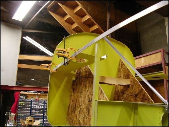 Position the upper longeron to the firewall and side skins.  Clamp in place.