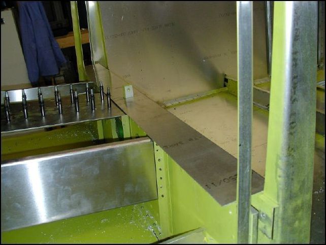 Trim the ends of 640-F-11-7 (seat panel) and fit over main spar.  The bent edge is at the back facing down.