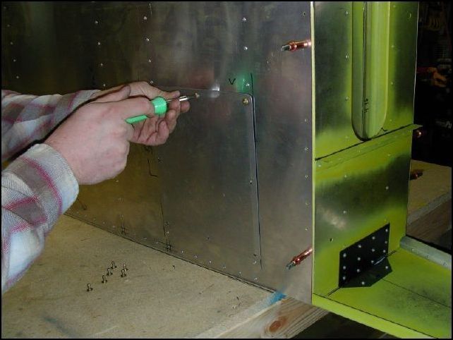 Screw access door cover to fuselage.