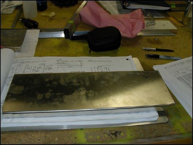 OK, now back to the seat channels.  Trim 640-F-11-1 to fit between the front and center spar.  Line them up to the edge of the fuselage.  NOTE:  I jogged the front of this part so that the skin will lay flat, the rear was already jogged.