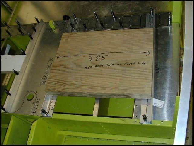 Position the seat panel, seat side channels, and seat rails to the fuselage.  The inside seat rails line up with the edge of the center seat panel.  The outside seat rails are 350 mm from the inside of the L that sticks up to the inside of the L on the inside.  Also the Longer edge of the rails lay flat and the short edge sticks up. 