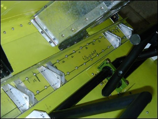 Position 20-C-7-2 (brake cylinder supports) as per drawing.  Drill and bolt / rivet in place.  The outside supports get bolted through the longerons and the rest of the supports are riveted with A5 rivets.