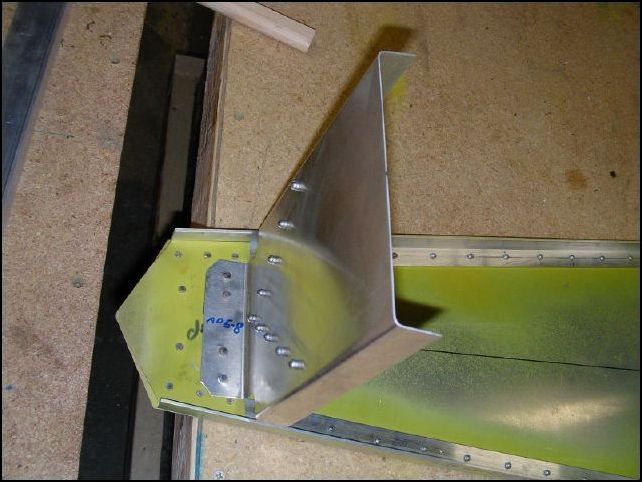 Rear fuselage panel riveted in place.