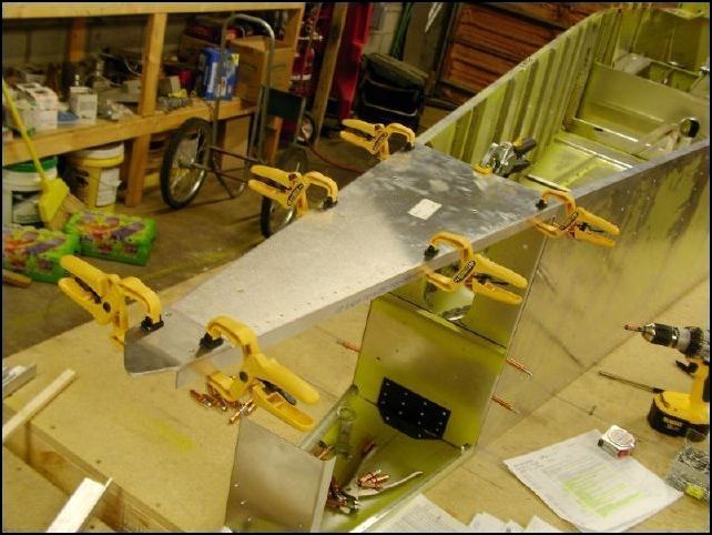 Positon the upper rudder hinge to the top of the rear upper skin.