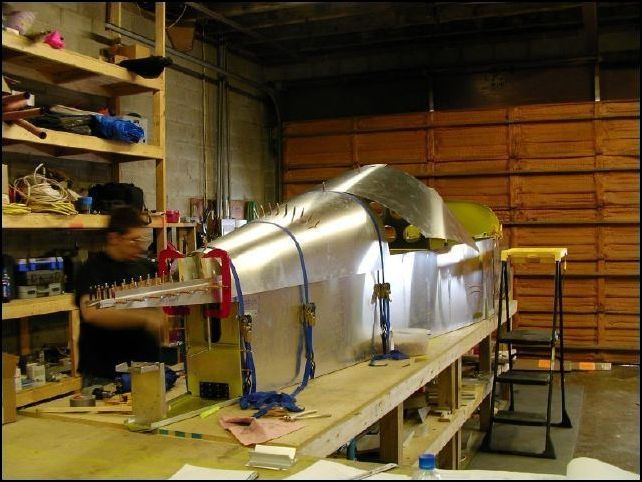 Now drill through the pre-punched holes in the rear skin for bulkhead 6.  Be sure that you are drilling in the center of the bulkhead lip and cleco as you go.  I started at the top and drilled one hole on each side then another on each side and continued this way until I had them all drilled and clecoed.