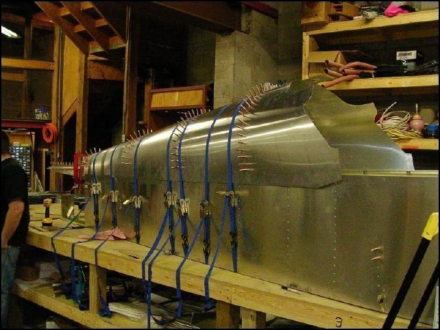 This is what the fuselage looked like when we completed drilling and clecoing the top skins to the bulkheads.  I also drilled the bulkheads to the top longerons, one A4 rivet hole on each side of each bulkhead.  I did NOT install bulkhead 3 at this time because I am going to install the optional bagage compartment so I need to cut the hole for this in that bulk head before installing it.