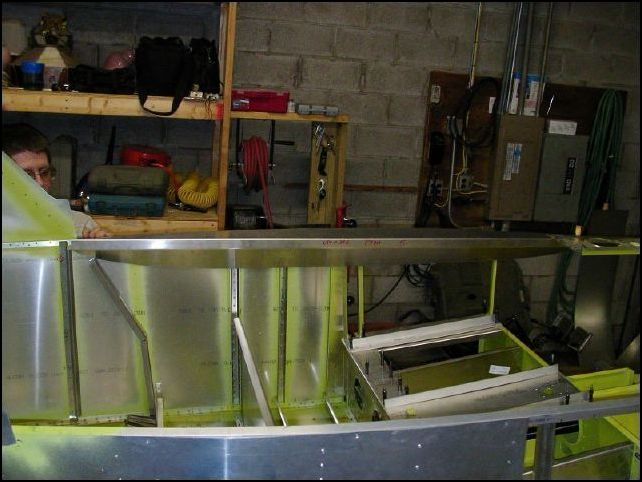 This image shows the second top longeron doubler being test fit to the fuselage.  I will have to file the edge smooth after riveting it in place.