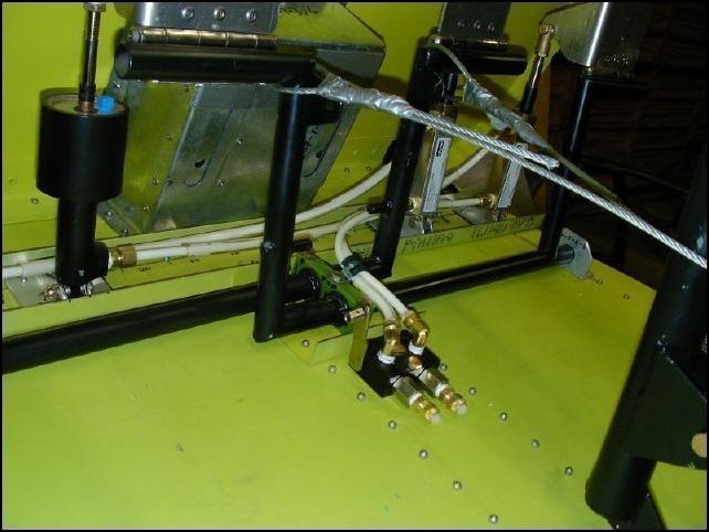 Conect brake lines from slave cylinders to parking brake valve.