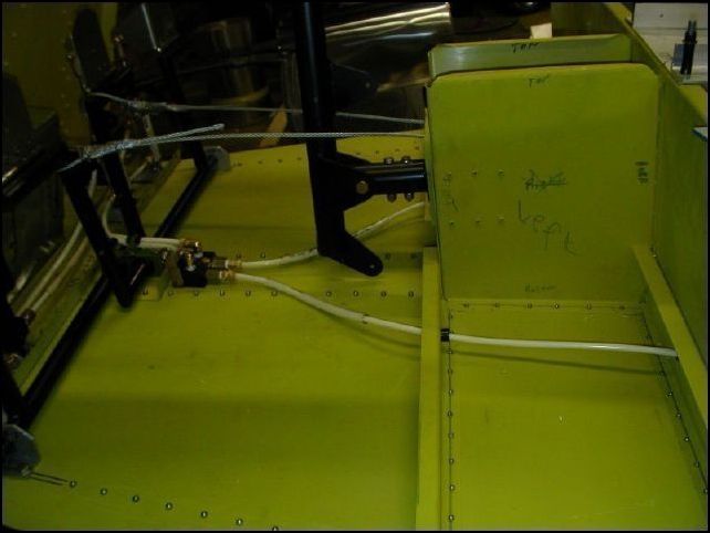 Install brake lines to parking brake valve and run through the front spar and center spar.  You may also want to run these lines through the bottom of the aircraft at this time however I did not.  I want to install the landing gear first and then think about how I want to run the brake lines to the brakes.  I really don't like the way the drawings have them run and think that I will run mine through the wings and then down the rear of the landing gear.
