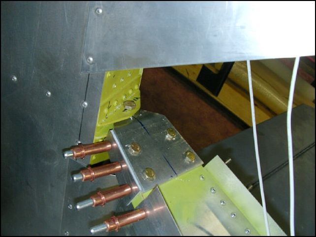 Drill and cleco the rudder stops to the top longerons.