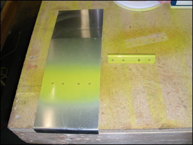 Deburr, clean, and prime torque tunnel cover and L angle.