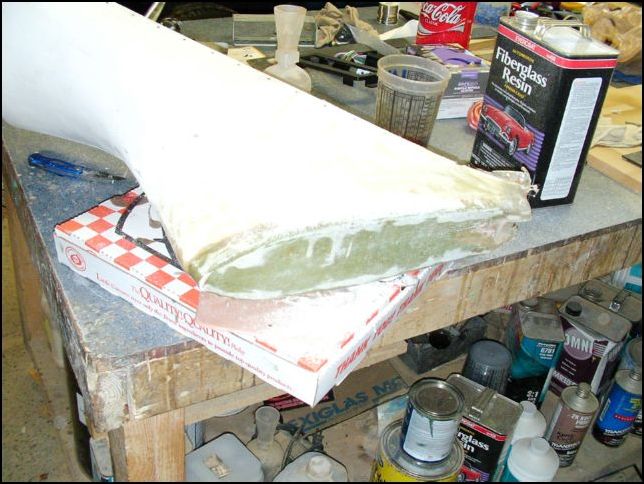 form a layer of fiberglass and resin over the molding foam, sand and apply second layer.