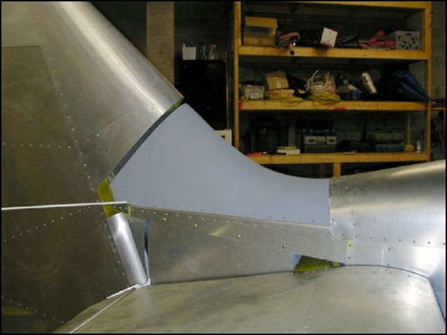 Rivet tail saddle to fuselage.  Now the gap is just enough to allow the rudder to clear.