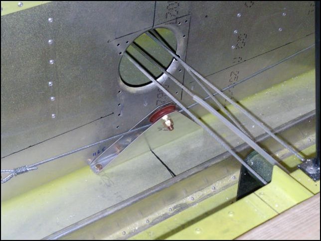 Install aileron pully assembly and rear aileron cable.