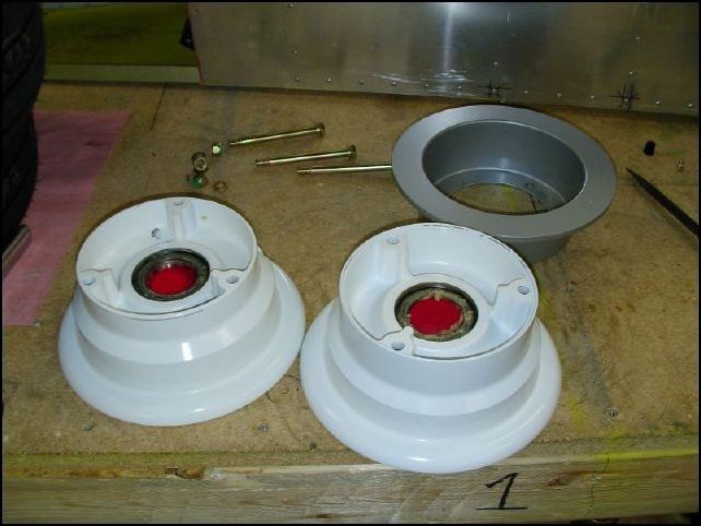 Assemble the main wheels.  To do this remove the three bolts that hold the wheel rim together and pull the rim apart.