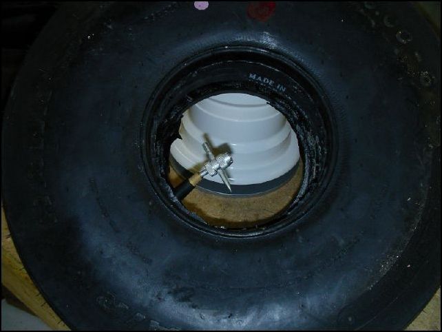 remove the valve stem core to let the air out of the tube.