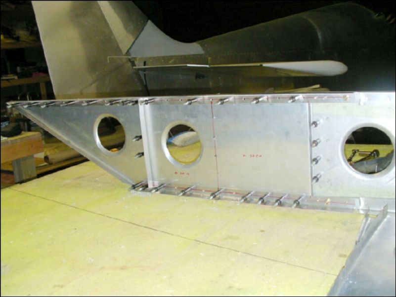 Drill the AN3 bolt holes through the wing extension into the spar.