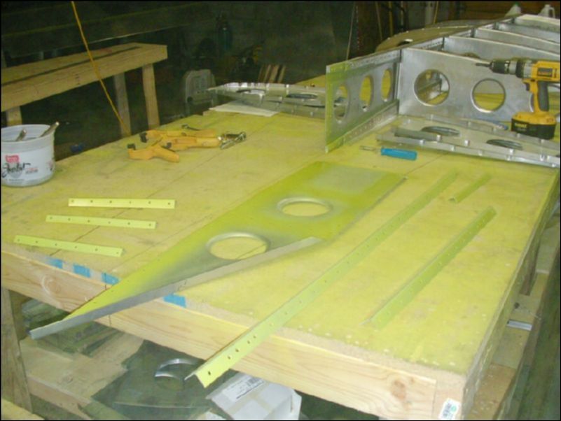 Deburr, clean, and prime wing tip extension parts.