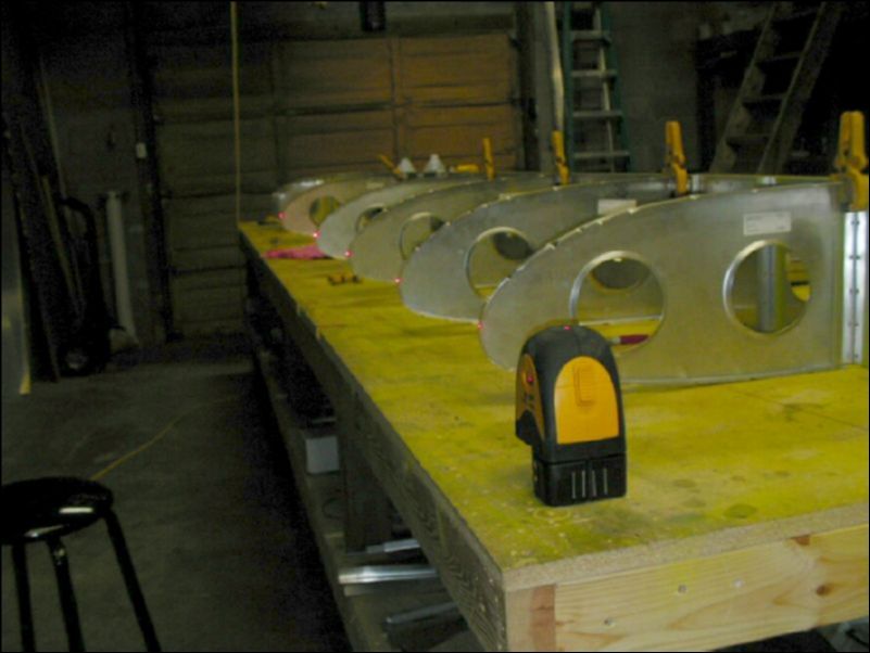 Line up nose rib 10 with the rest of the ribs.  Drill and cleco nose rib 10 to the wing spar extension.