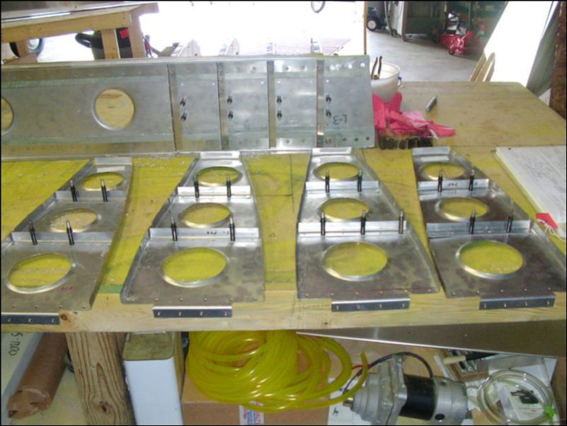 Cut, drill, and cleco support L's to rear ribs 1 - 4.