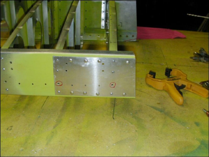 Install solid rivets in rear wing pickup