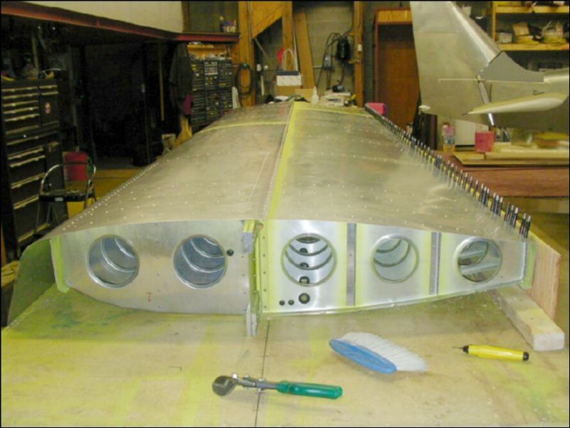 Deburr, clean, prime, and rivet all bottom skins.  Do not rivet to rear channel yet.