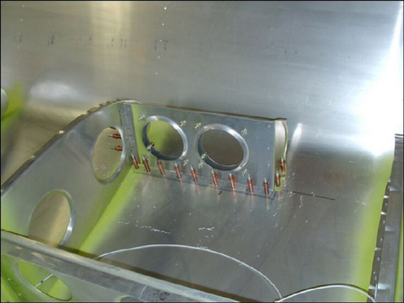 Drill and cleco the landing light assembly in position.