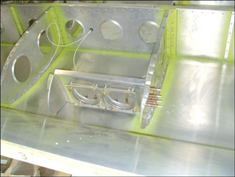 Drill and cleco the landing light assembly in position.