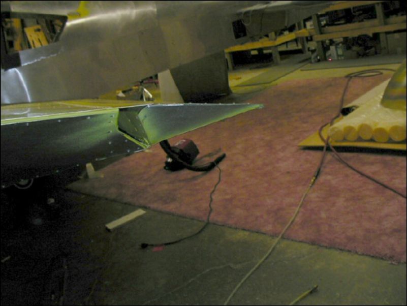 Deburr, clean, prime, and rivet the aileron tip.