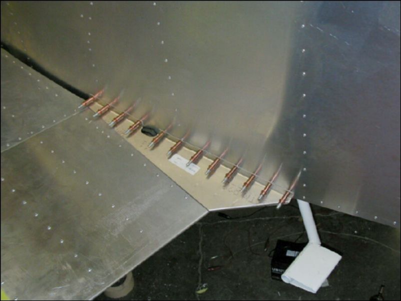 Drill and cleco the flap fairing to the side of the fuselage.  I had to make a small cut out because the fairing was hitting the flap bar bushing.