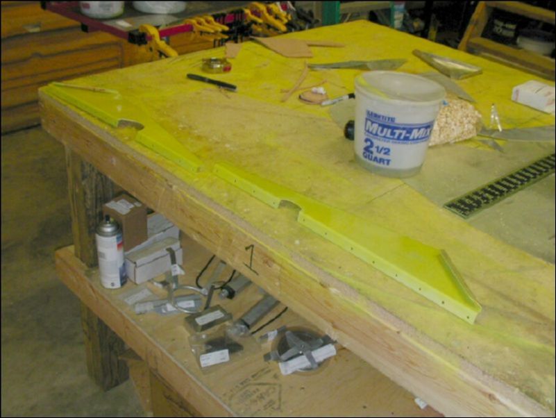 Deburr, clean, and prime the flap fairings.