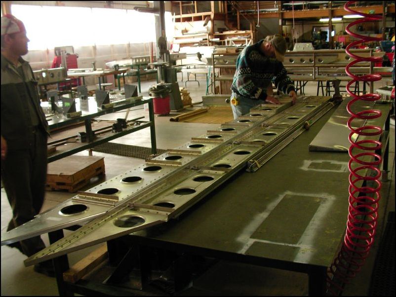 Zenair employees building wing spars I think.