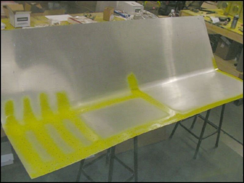 Deburr, clean, and prime bottom wing skins.
