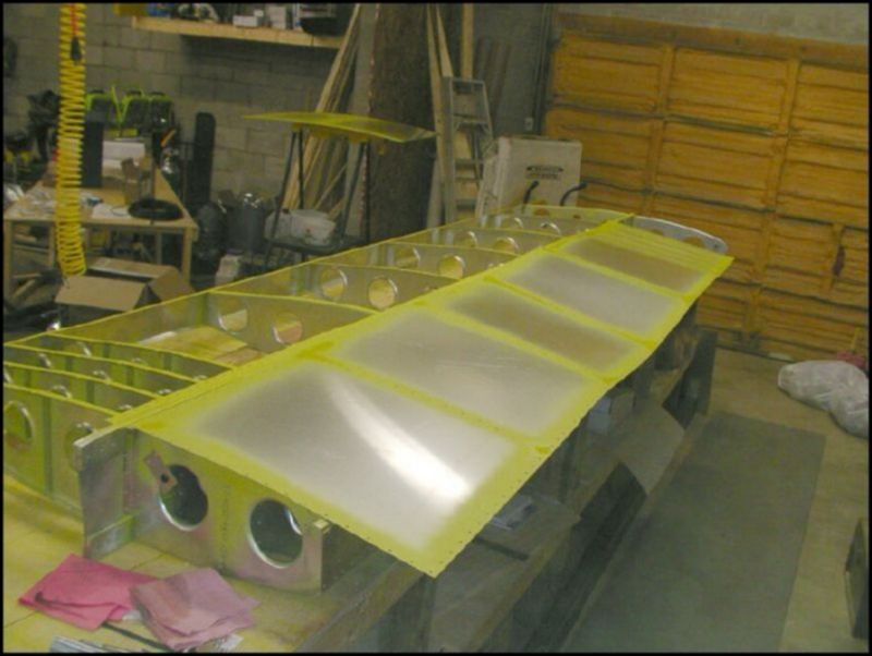 Deburr, clean, and prime wing ribs.