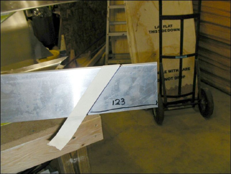 Mark and cut the O.B. end of the aileron support channel.