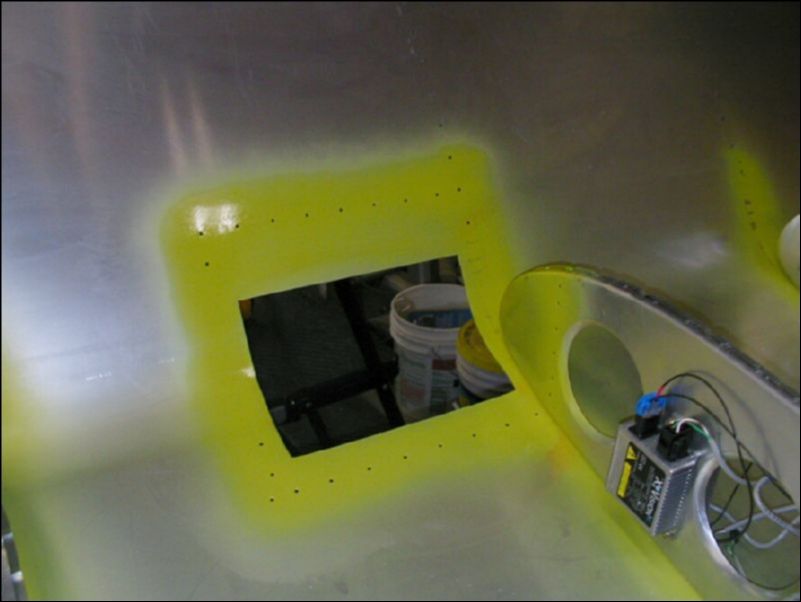 Deburr, clean, and prime wing area for landing / taxi light assembly